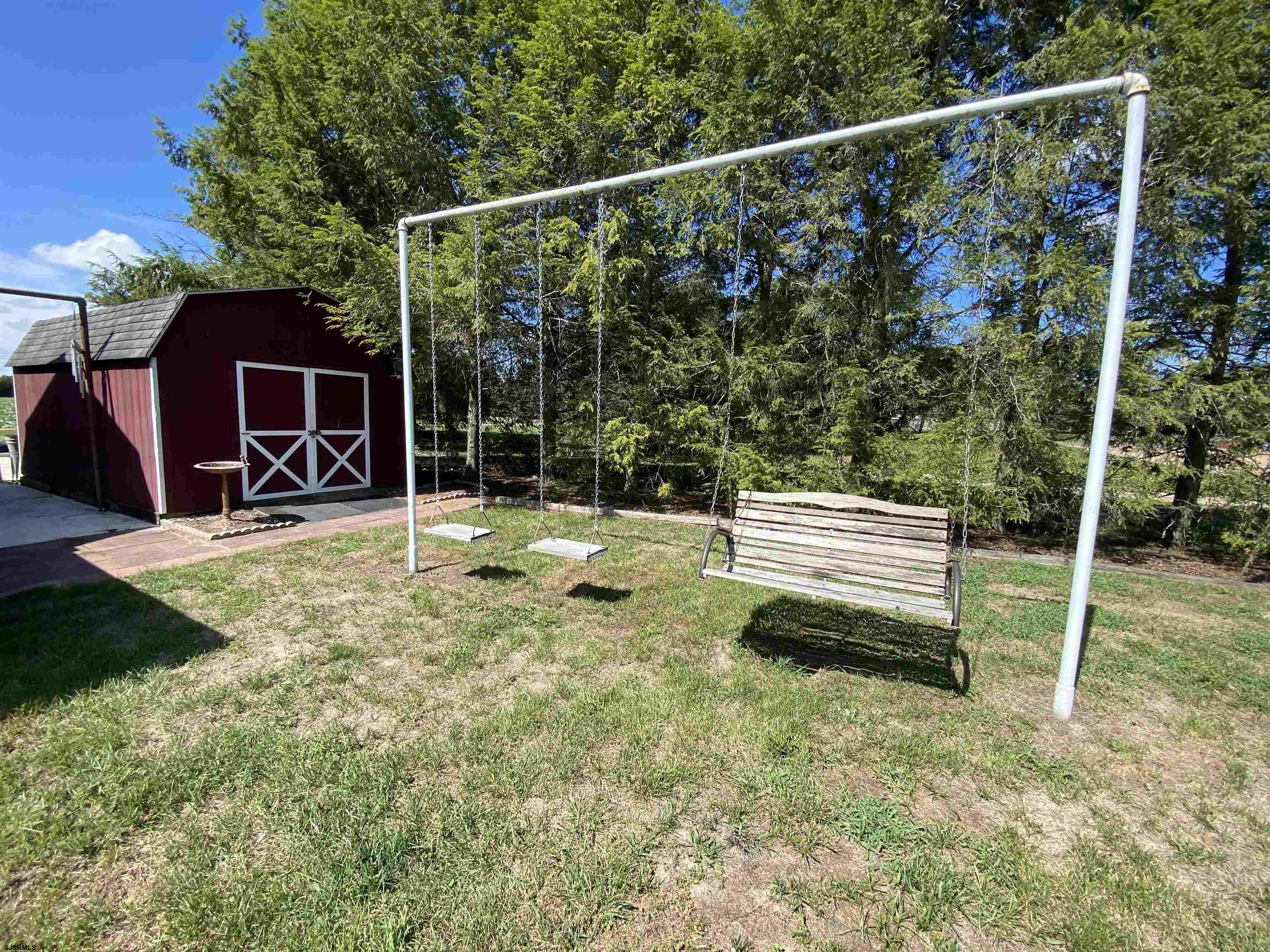 346 Tuckahoe Road Vineland, NJ 08360 - Photo 35 of 44 a view of a park with swings