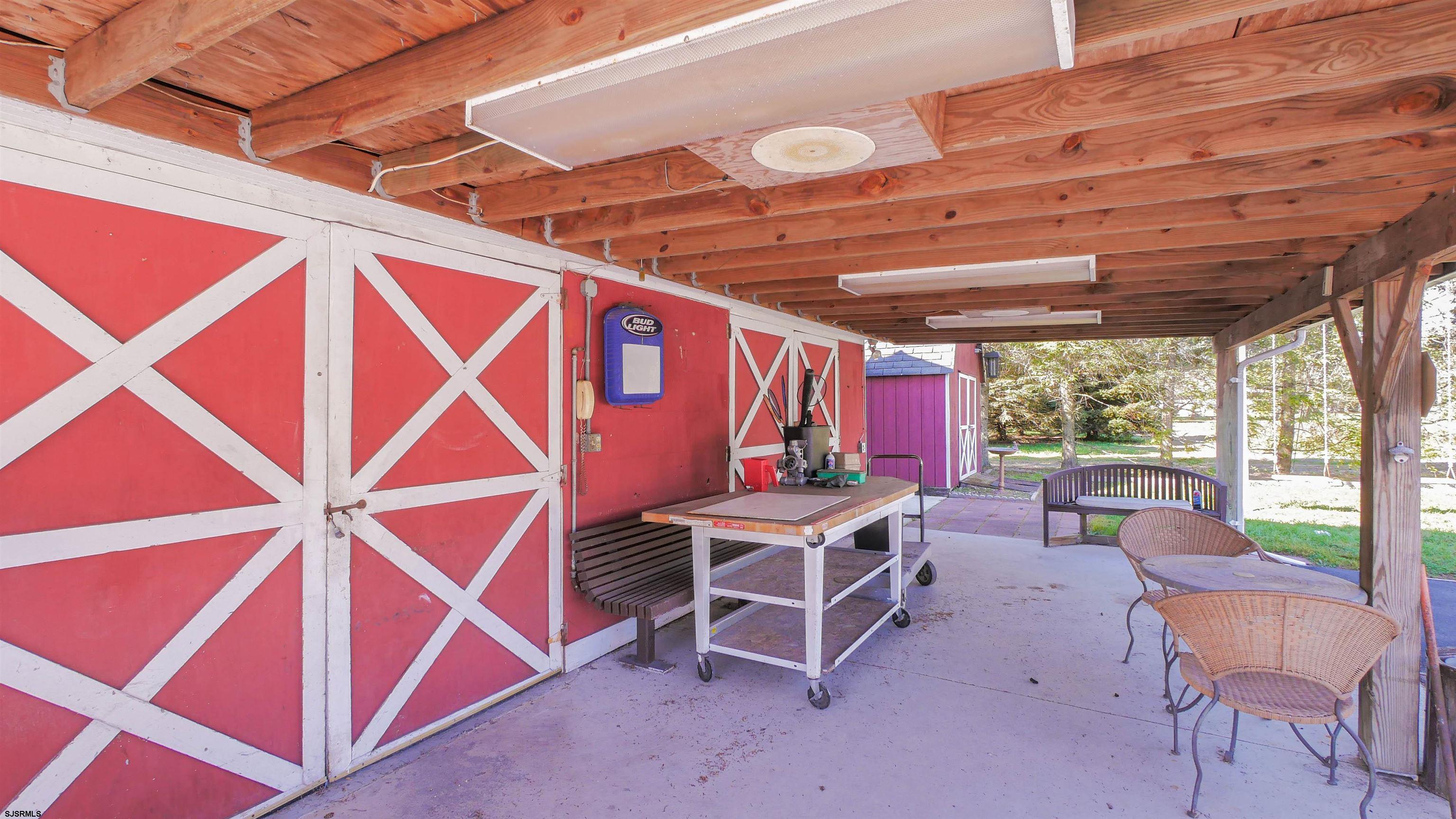 346 Tuckahoe Road Vineland, NJ 08360 - Photo 36 of 44 a view of a patio with table and chairs and a barbeque