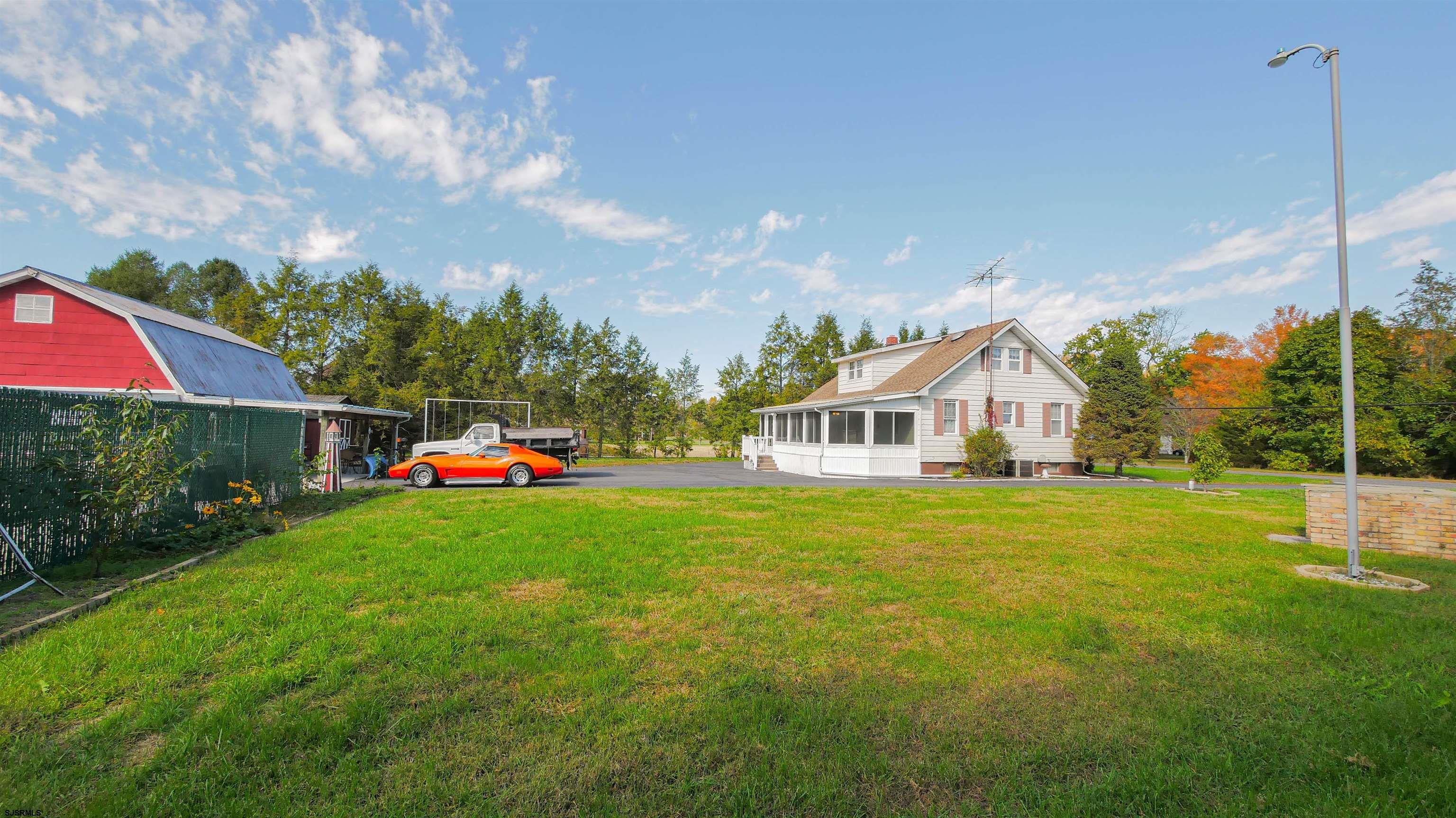 346 Tuckahoe Road Vineland, NJ 08360 - Photo 6 of 44 a front view of a house with garden