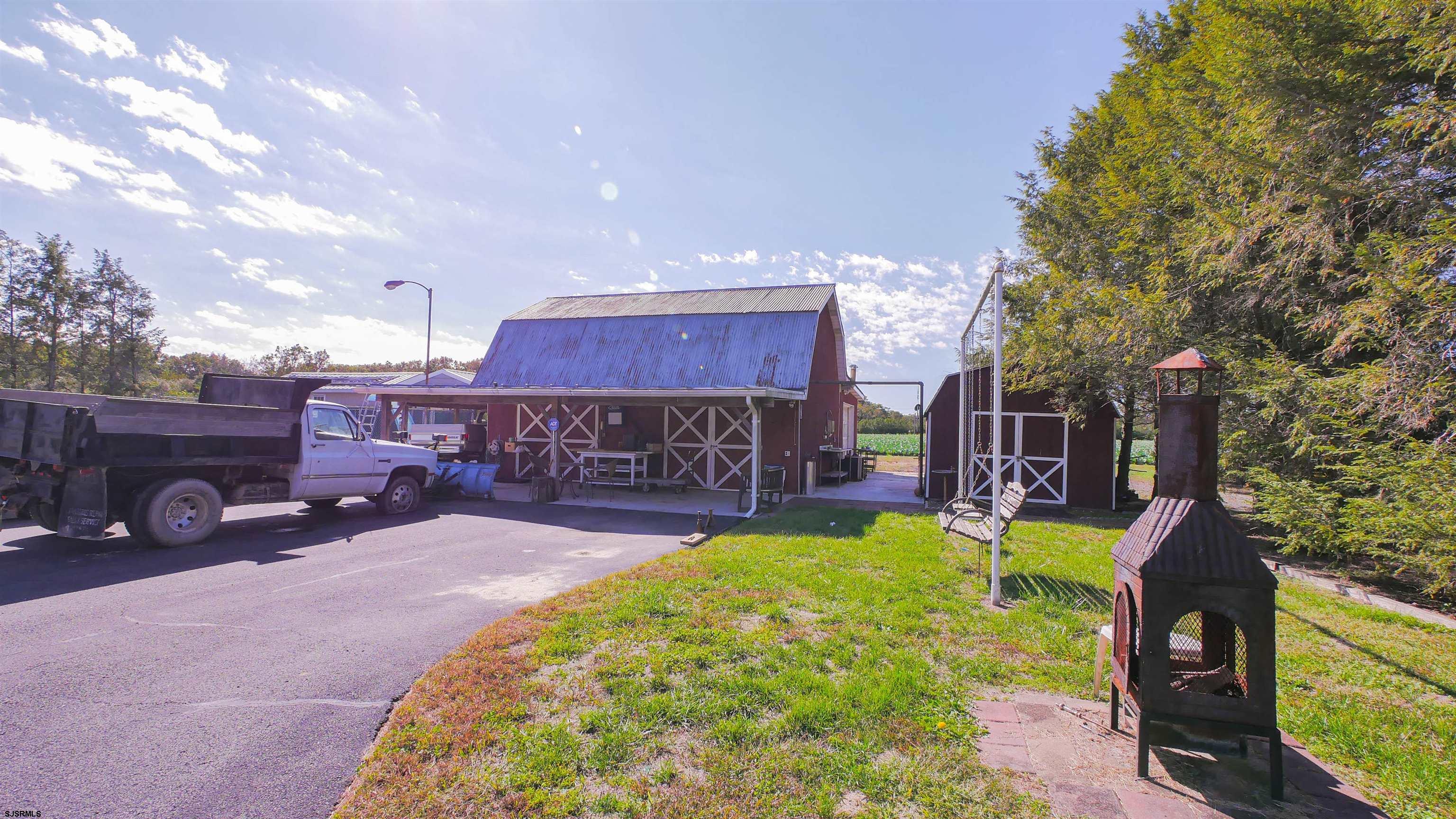346 Tuckahoe Road Vineland, NJ 08360 - Photo 7 of 44 a view of a house with a yard patio and fire pit