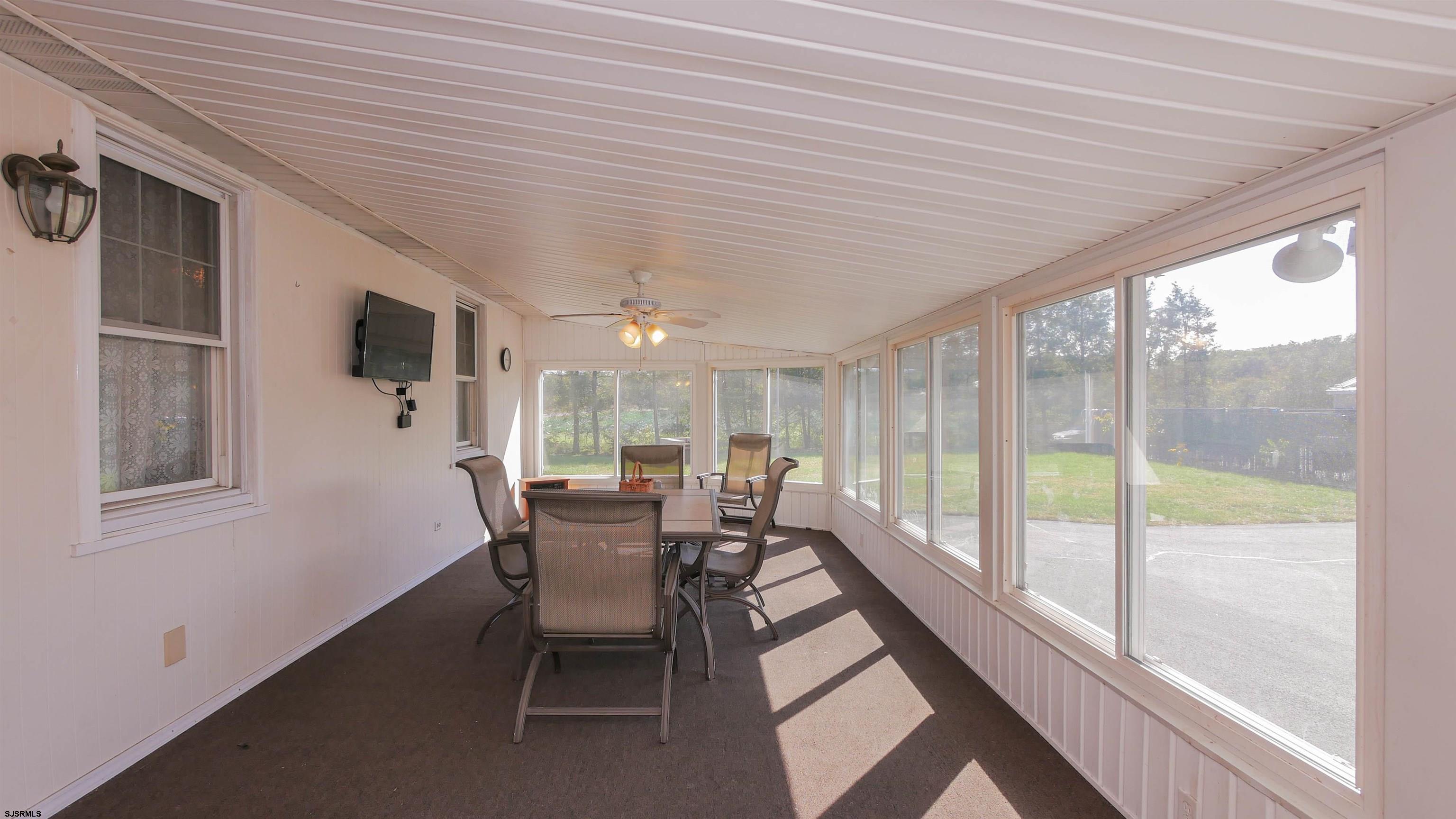 346 Tuckahoe Road Vineland, NJ 08360 - Photo 9 of 44 a dining room with furniture and large windows