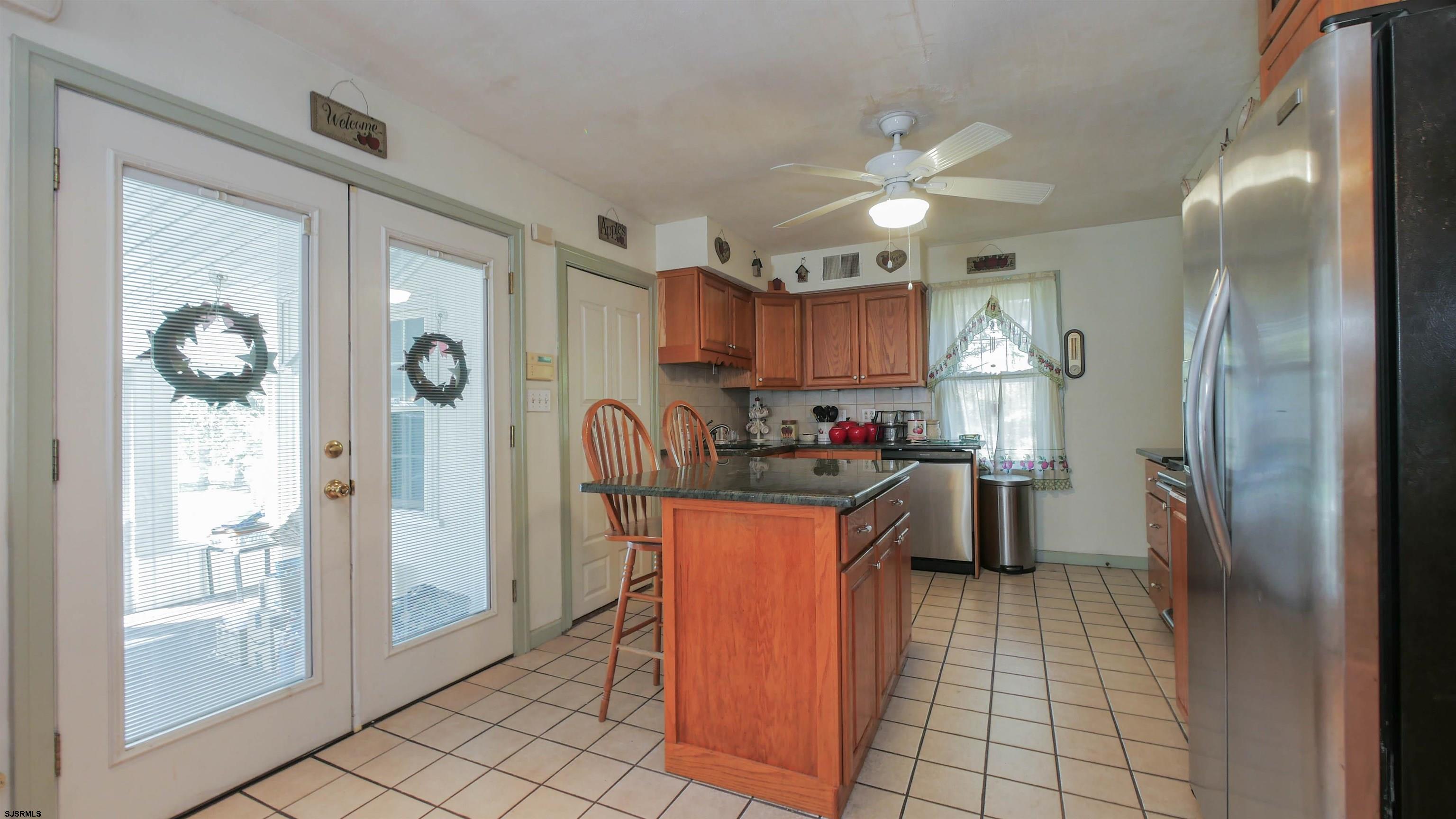 346 Tuckahoe Road Vineland, NJ 08360 - Photo 10 of 44 a kitchen with stainless steel appliances granite countertop a refrigerator and a sink