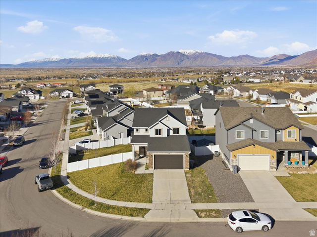 1218 Moonlight Drive Elk Ridge, UT 84651 - Photo 39 of 44 Aerial perspective of suburban area featuring a mountainous background
