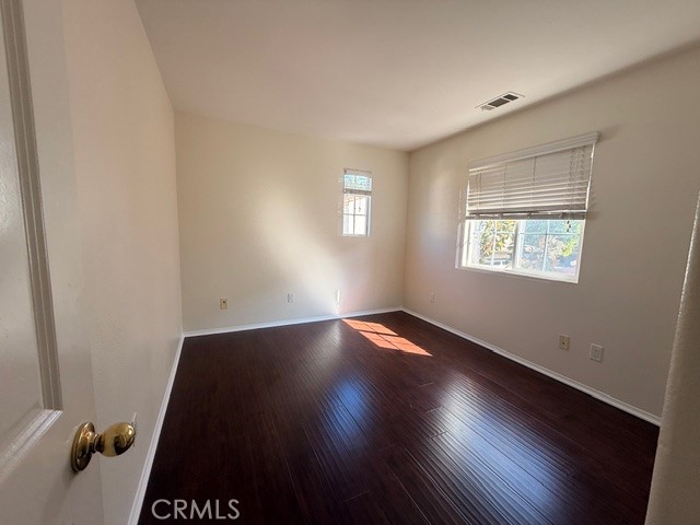 5 Del Mar Irvine, CA 92602 - Photo 13 of 15 an empty room with wooden floor and windows