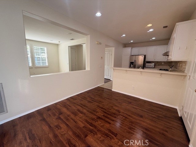 5 Del Mar Irvine, CA 92602 - Photo 7 of 15 a view of a kitchen with a sink and a microwave