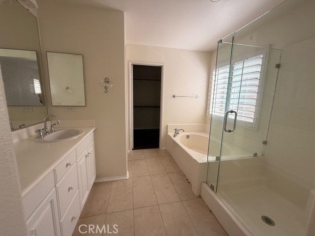 5 Del Mar Irvine, CA 92602 - Photo 10 of 15 a bathroom with a granite countertop sink a mirror and a bathtub