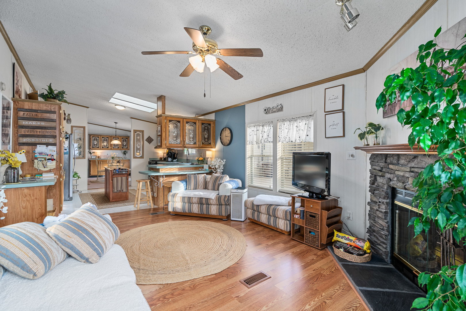 22710 South Ravisloe Lane Frankfort, IL 60423 - Photo 12 of 35 a living room with furniture and a fireplace