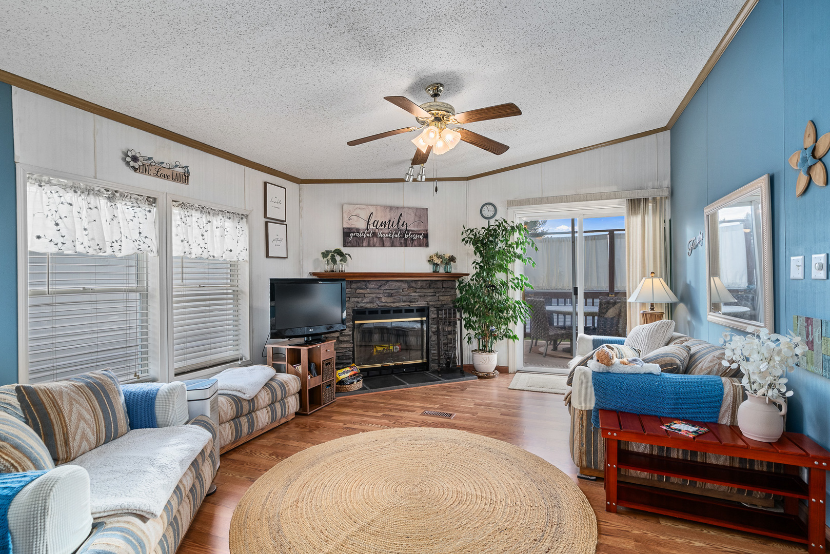 22710 South Ravisloe Lane Frankfort, IL 60423 - Photo 14 of 35 a living room with furniture a fireplace and a flat screen tv