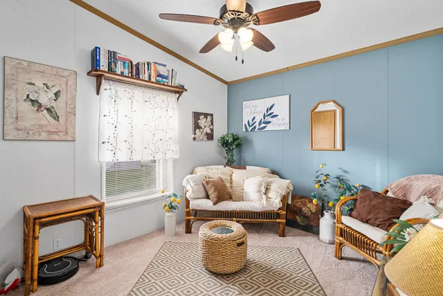 a bedroom with furniture and a window