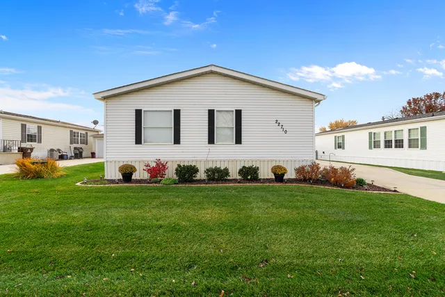 a view of a backyard with plants and a garden