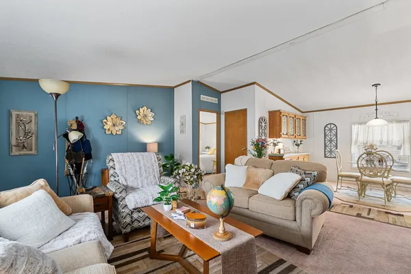 a living room with furniture and a table