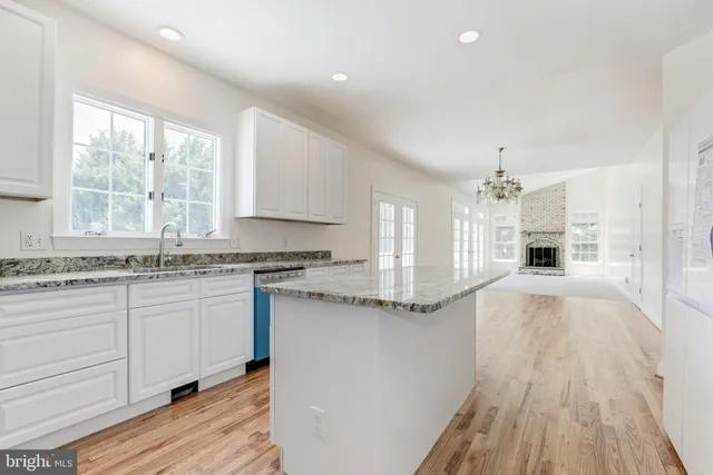 a bathroom with a sink a mirror and a toilet