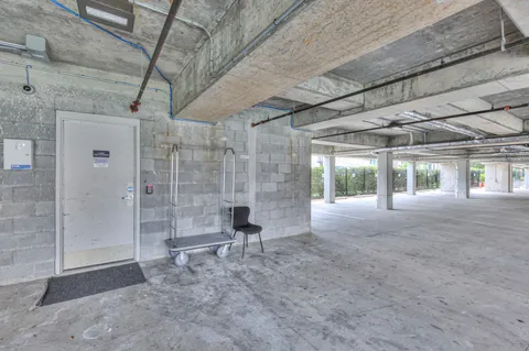 a view of an empty room with windows and yard