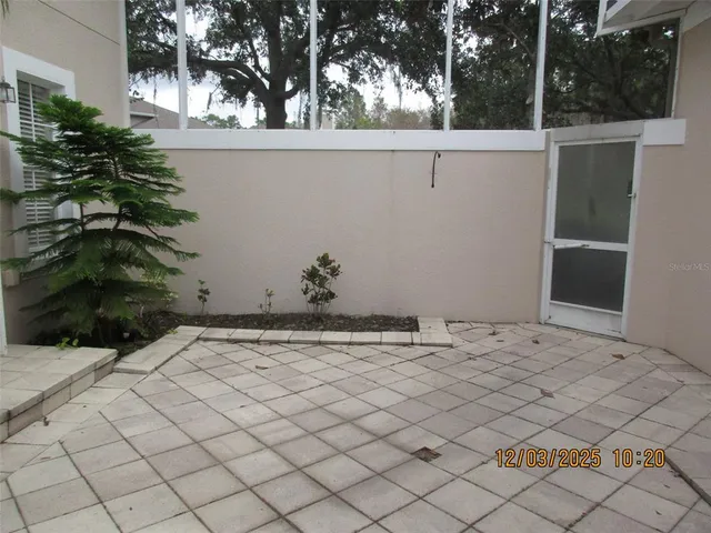 a view of a backyard of the house