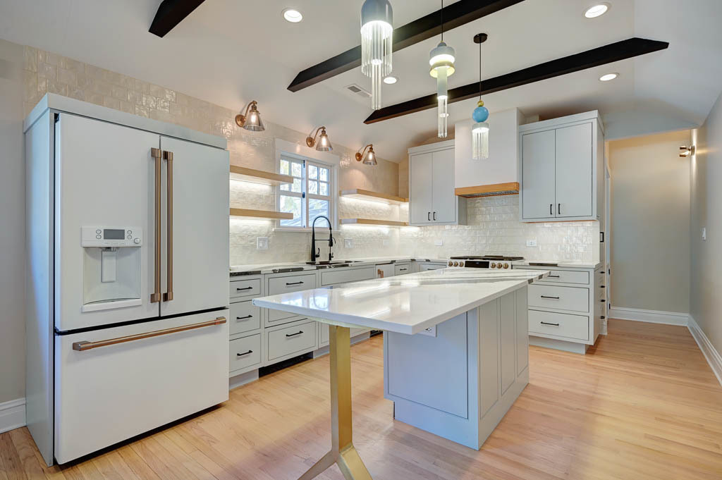 2211 Pioneer Road Evanston, IL 60201 - Photo 8 of 20 a kitchen with stainless steel appliances a sink cabinets and wooden floor