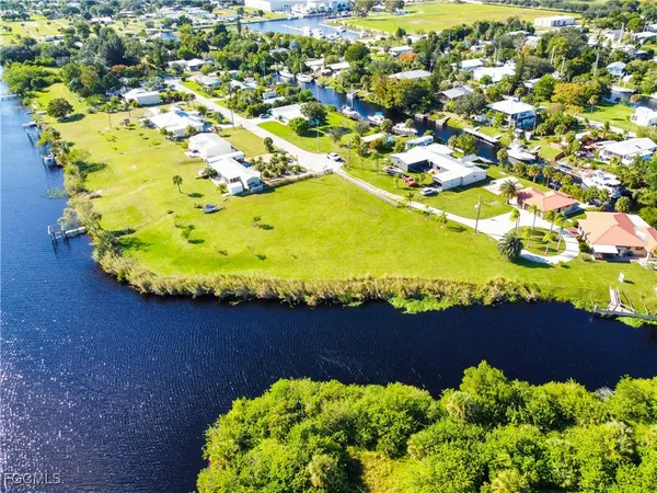 a view of a swimming pool a garden and plants