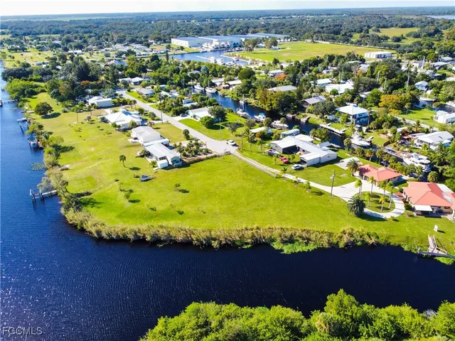 a view of a swimming pool with a yard