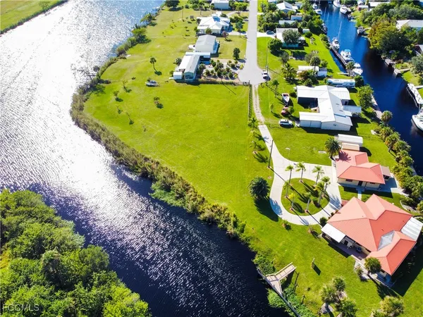 a view of swimming pool with a dining table and chairs