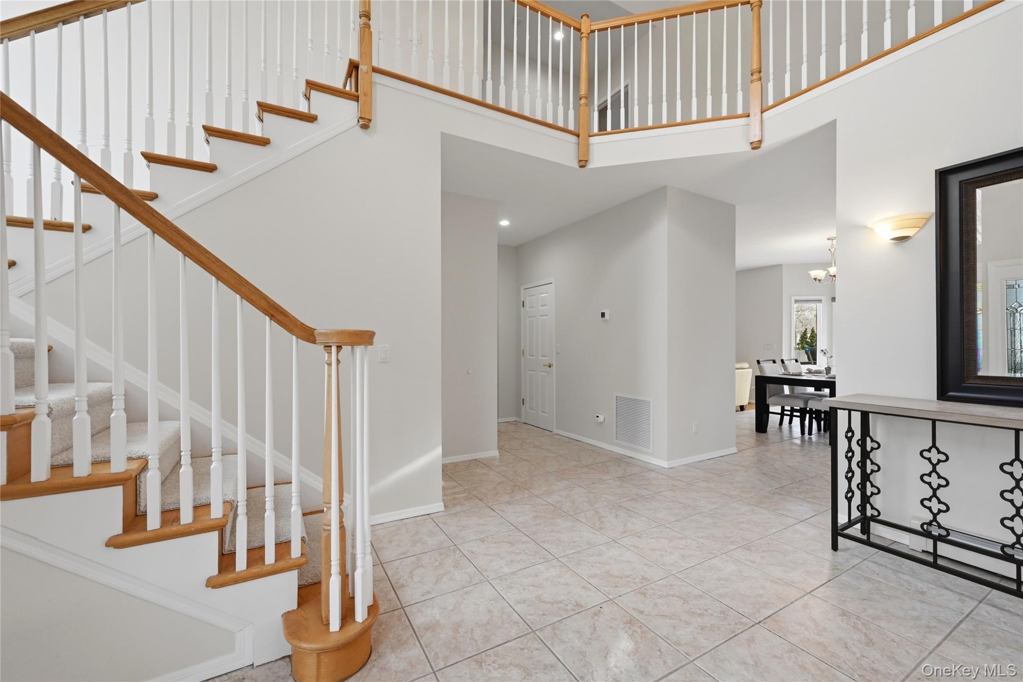 5 Mill Race Road Hampton Bays, NY 11946 - Photo 20 of 34 a view of entryway and hall with wooden floor