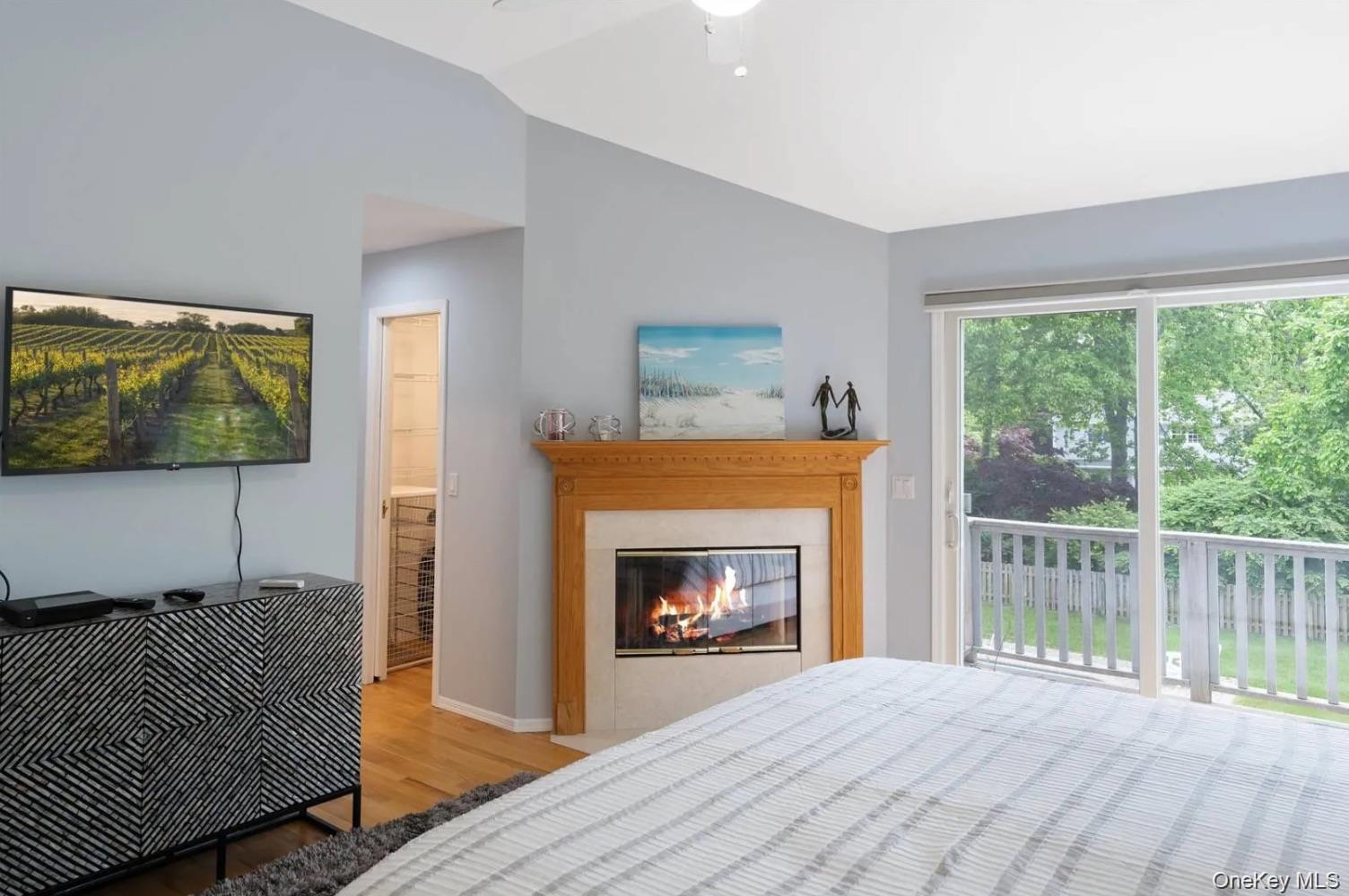 5 Mill Race Road Hampton Bays, NY 11946 - Photo 23 of 34 a living room with furniture and a fireplace