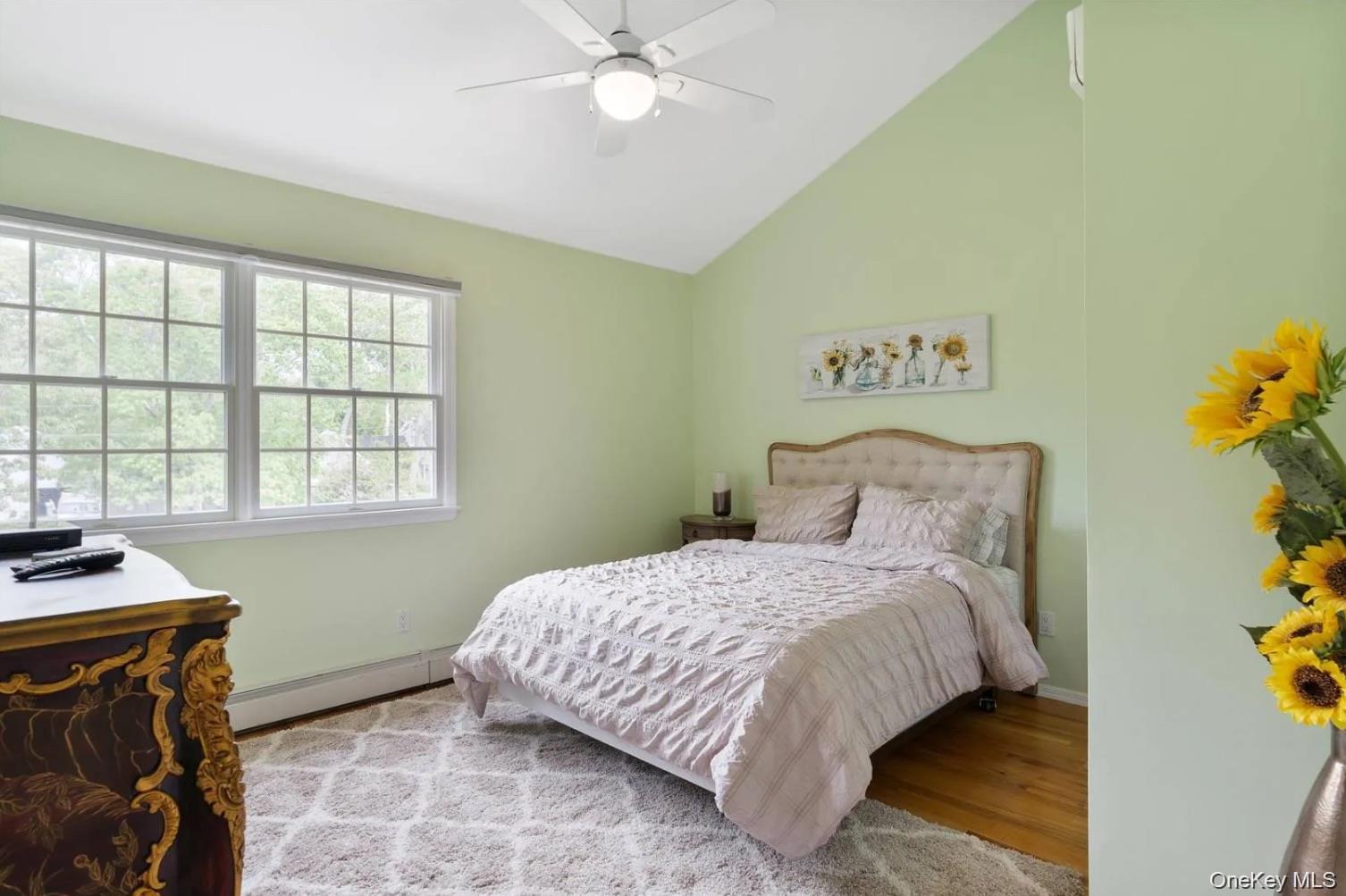 5 Mill Race Road Hampton Bays, NY 11946 - Photo 31 of 34 a bedroom with a bed and a window