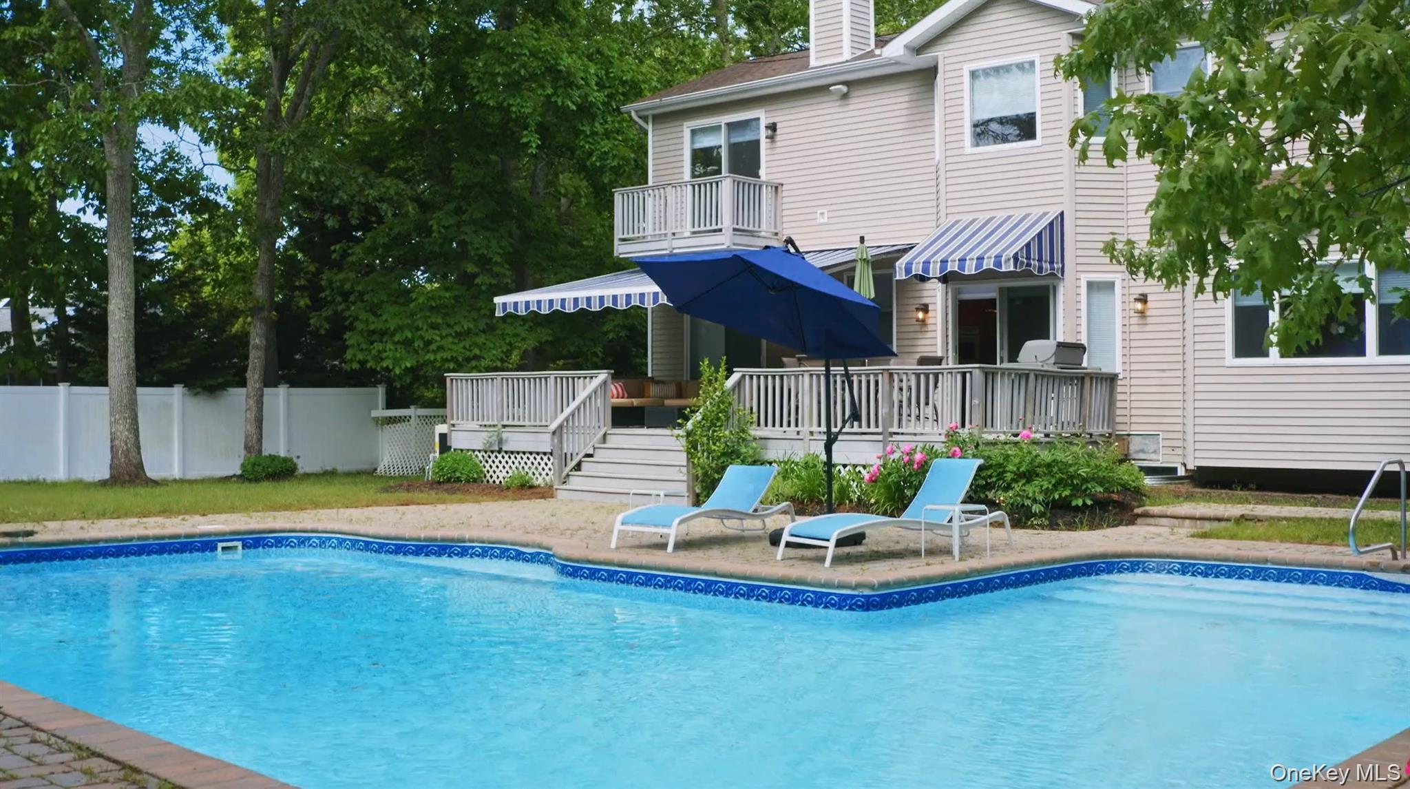 5 Mill Race Road Hampton Bays, NY 11946 - Photo 4 of 34 a house with swimming pool in front of it