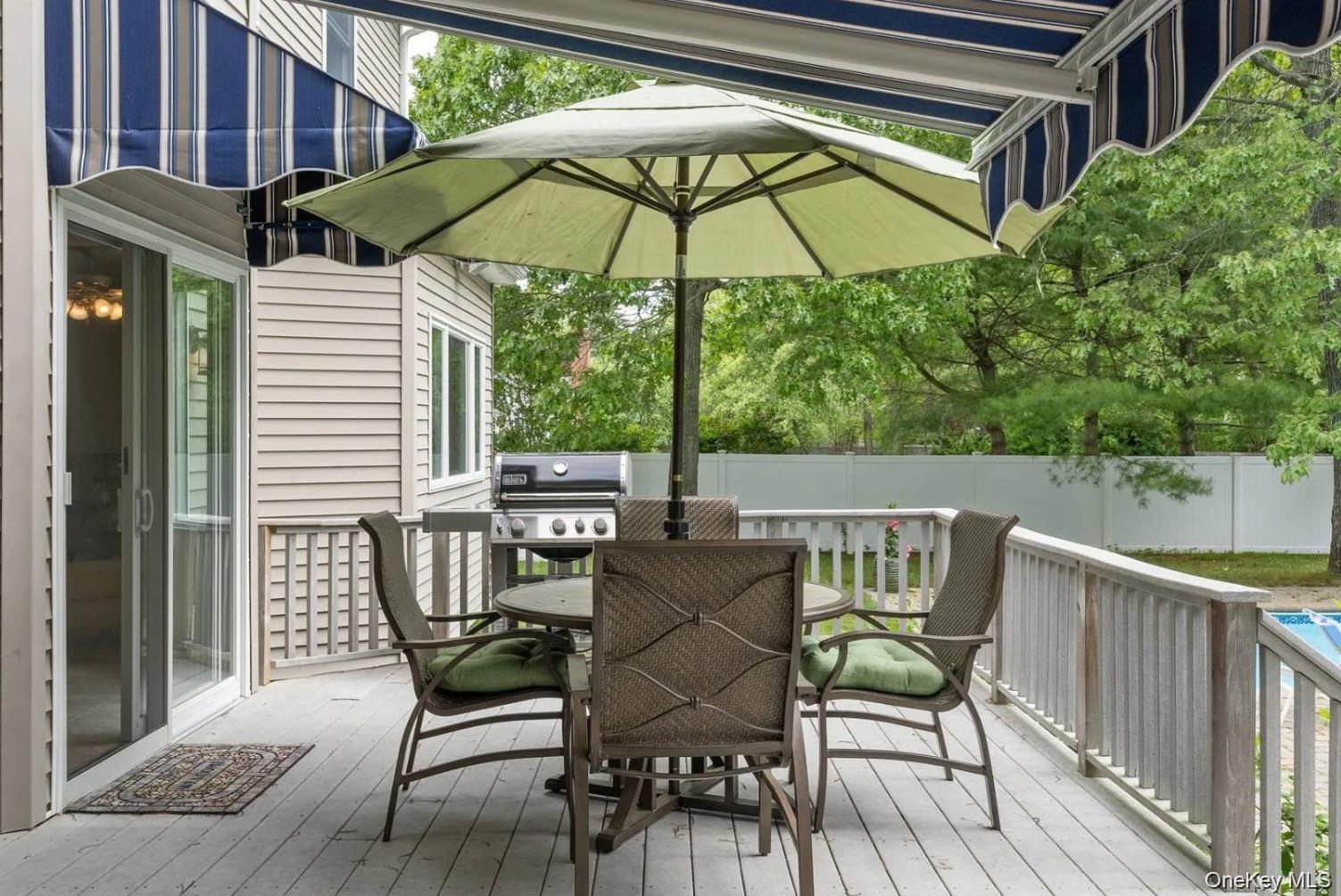 5 Mill Race Road Hampton Bays, NY 11946 - Photo 7 of 34 a view of chair and table in the balcony