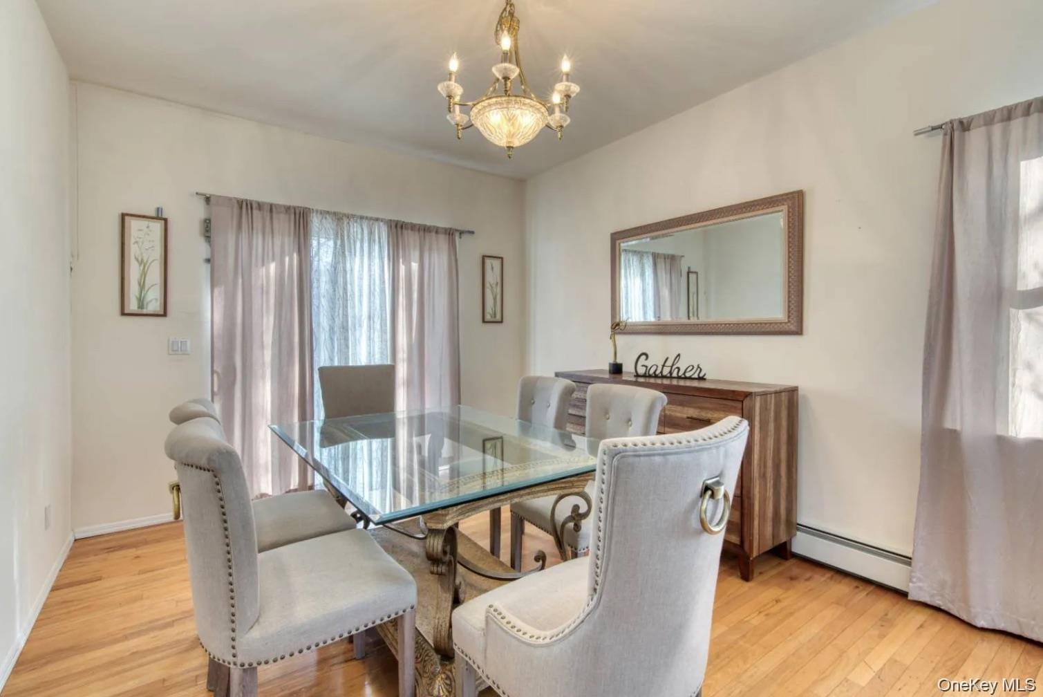 5 Mill Race Road Hampton Bays, NY 11946 - Photo 8 of 34 a view of a dining room with furniture window and wooden floor