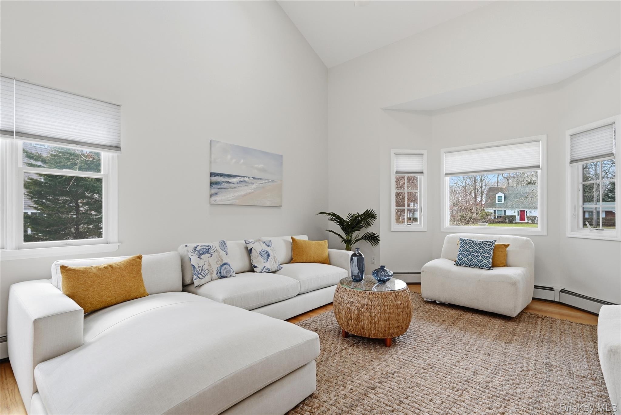 5 Mill Race Road Hampton Bays, NY 11946 - Photo 10 of 34 a living room with furniture and a large window