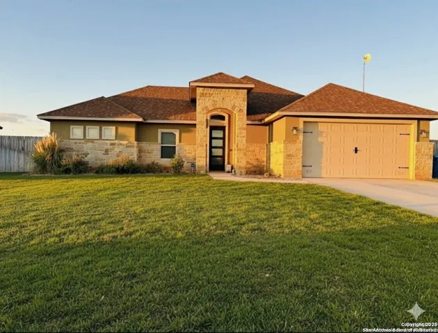a front view of a house with yard