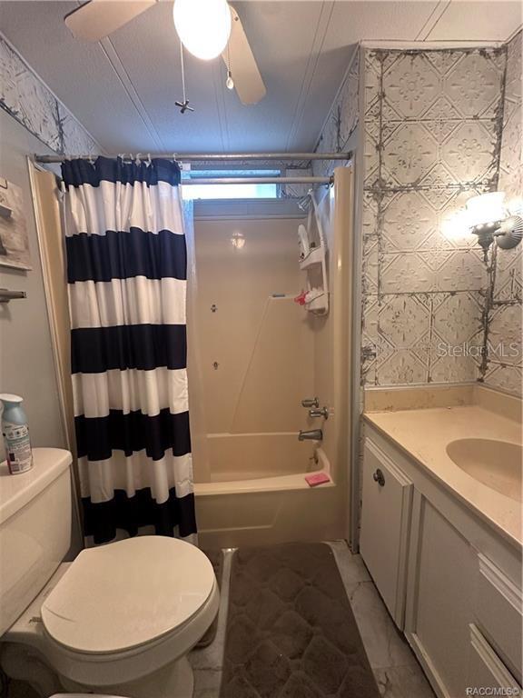 4010 East Dandy Loop Hernando, FL 34442 - Photo 11 of 30 a bathroom with a sink a toilet a shower and a mirror