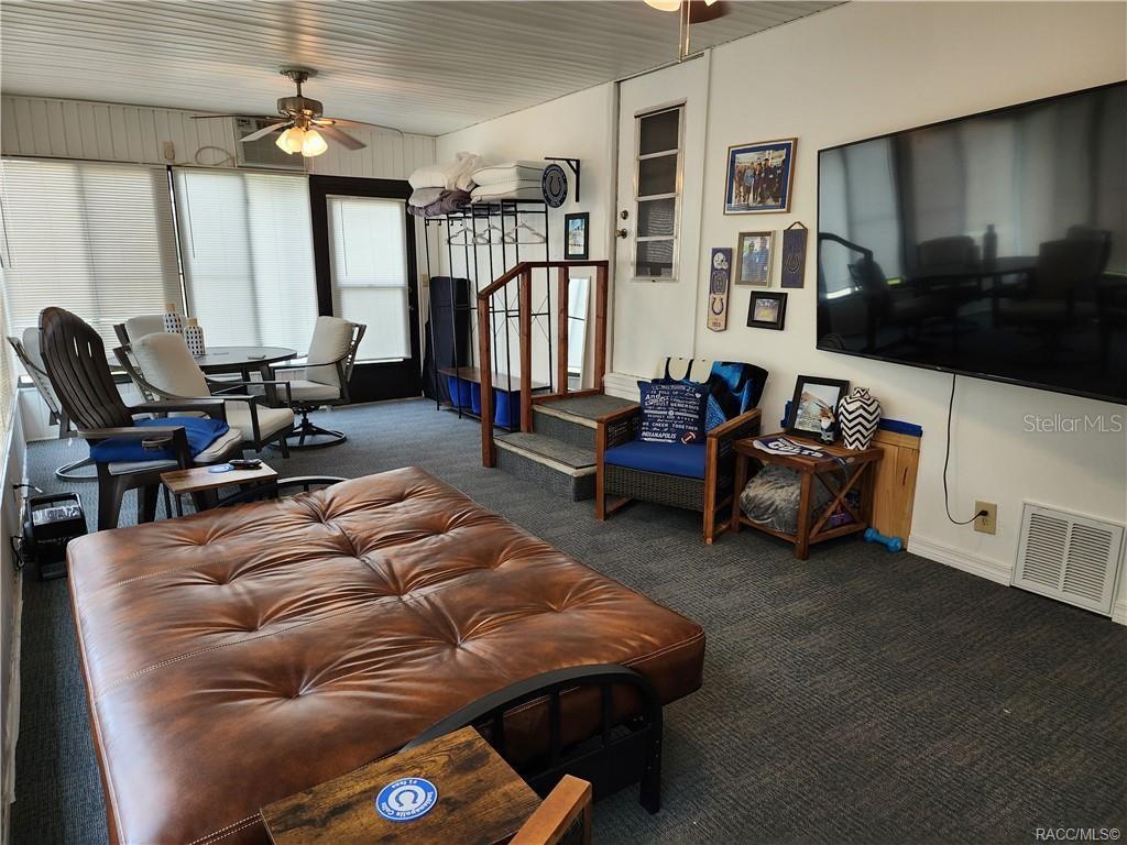 4010 East Dandy Loop Hernando, FL 34442 - Photo 14 of 30 a living room with furniture and a flat screen tv