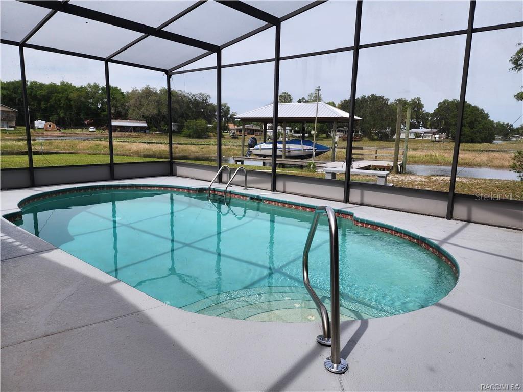 4010 East Dandy Loop Hernando, FL 34442 - Photo 20 of 30 a view of a swimming pool with a porch