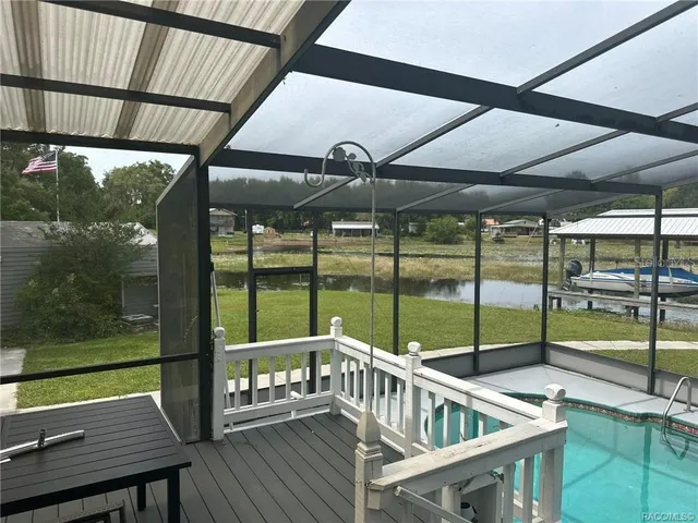 a view of a balcony with furniture