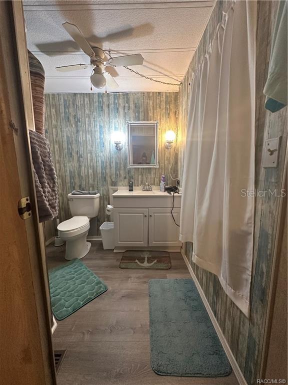 4010 East Dandy Loop Hernando, FL 34442 - Photo 8 of 30 a bathroom with a sink a toilet a mirror and shower