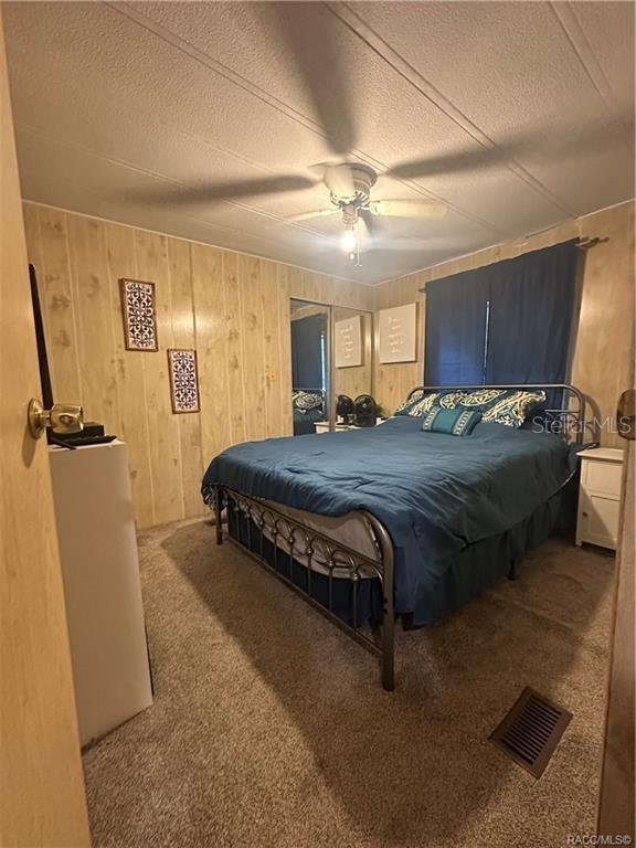 4010 East Dandy Loop Hernando, FL 34442 - Photo 10 of 30 a spacious bedroom with a bed and a table