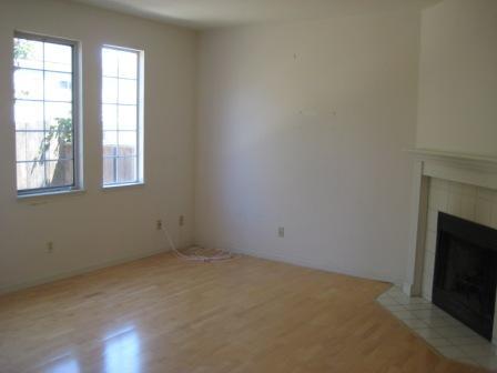 1486 Adeline Street Oakland, CA 94607 - Photo 4 of 23 Bright living room with fireplace.
