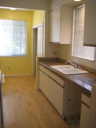 1486 Adeline Street Oakland, CA 94607 - Photo 8 of 23 Galley style kitchen with granite counters.