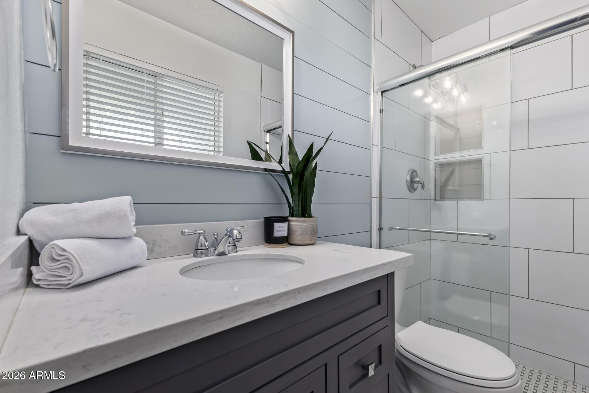 424 East Fillmore Street Tempe, AZ 85288 - Photo 12 of 20 a bathroom with a sink toilet and shower