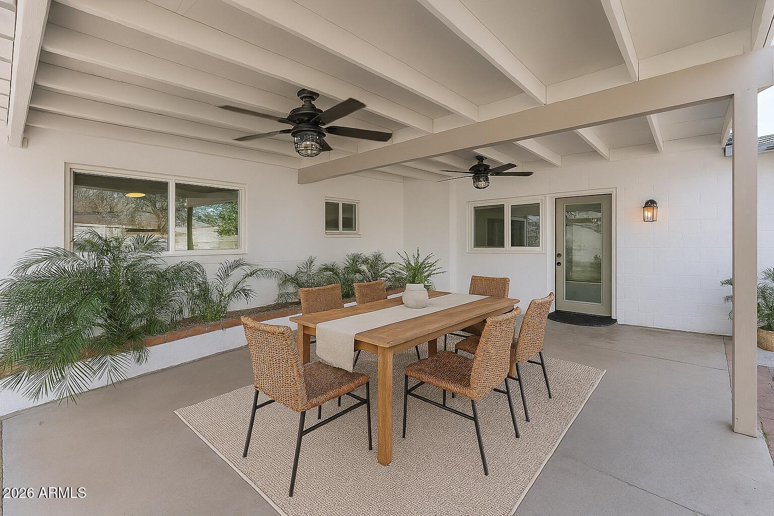 424 East Fillmore Street Tempe, AZ 85288 - Photo 6 of 20 a view of a patio with table and chairs and potted plants