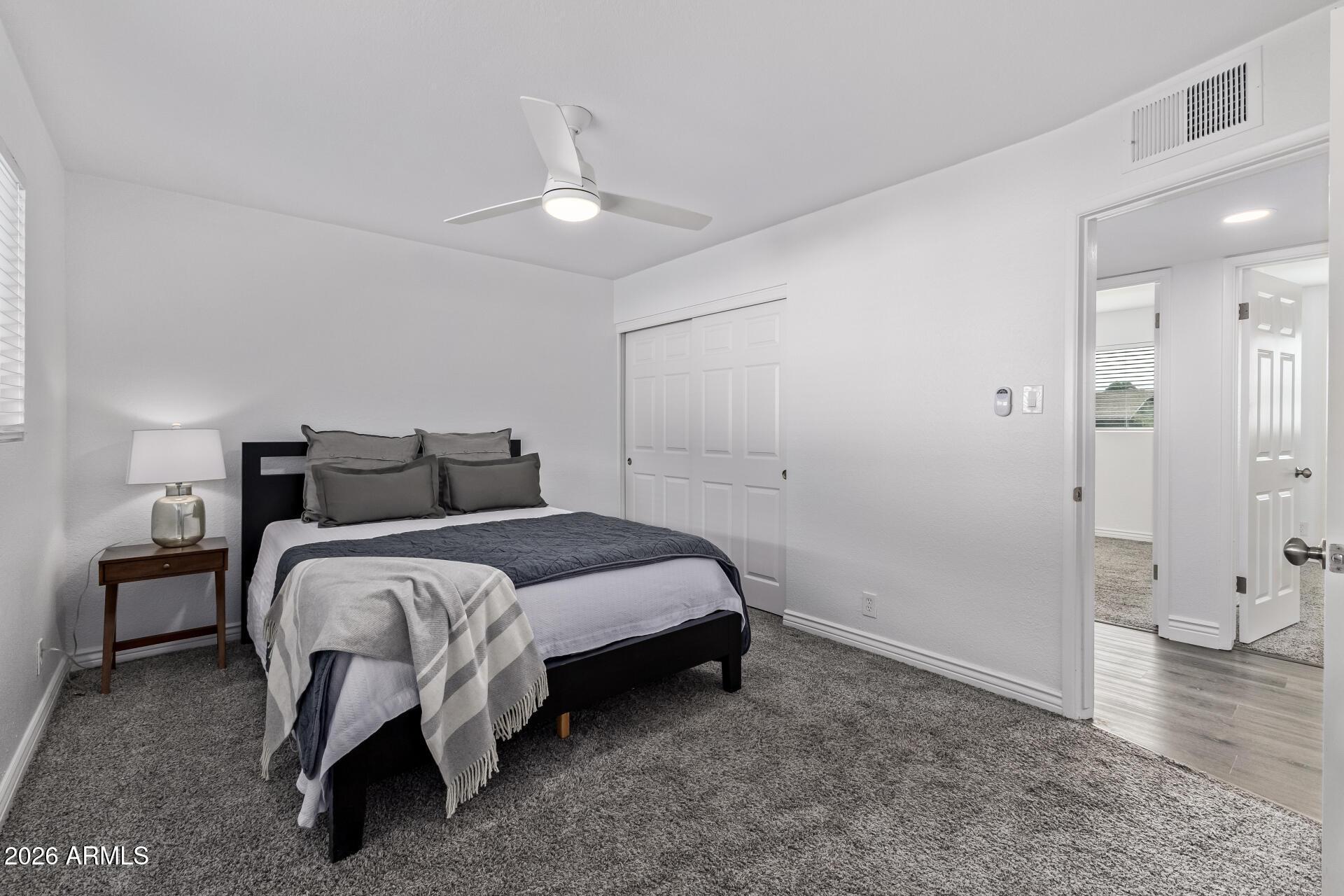 424 East Fillmore Street Tempe, AZ 85288 - Photo 9 of 20 a bedroom with a bed and a walk in closet