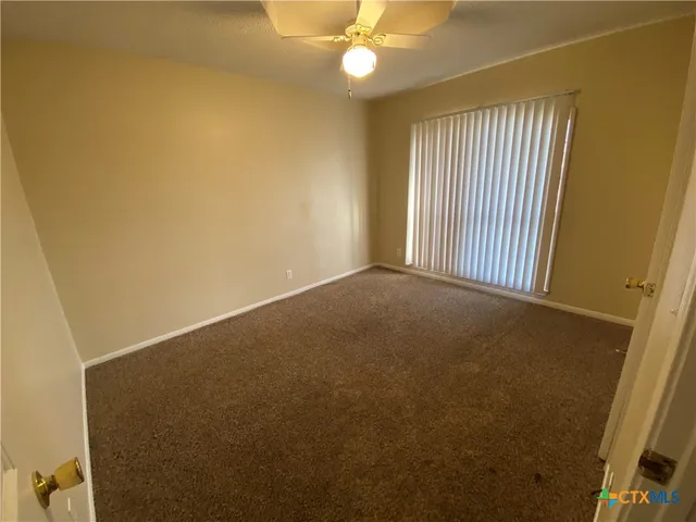 a view of a storage and utility room with a sink
