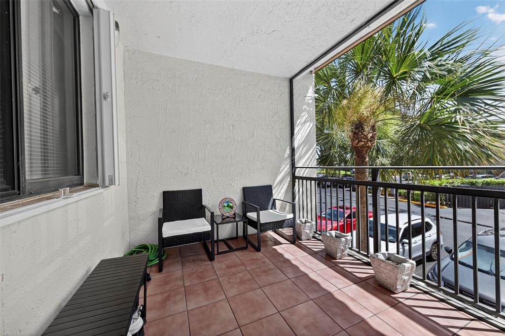 412 Lakeview Drive, Unit 202 Weston, FL 33326 - Photo 11 of 34 a view of two chairs in a balcony