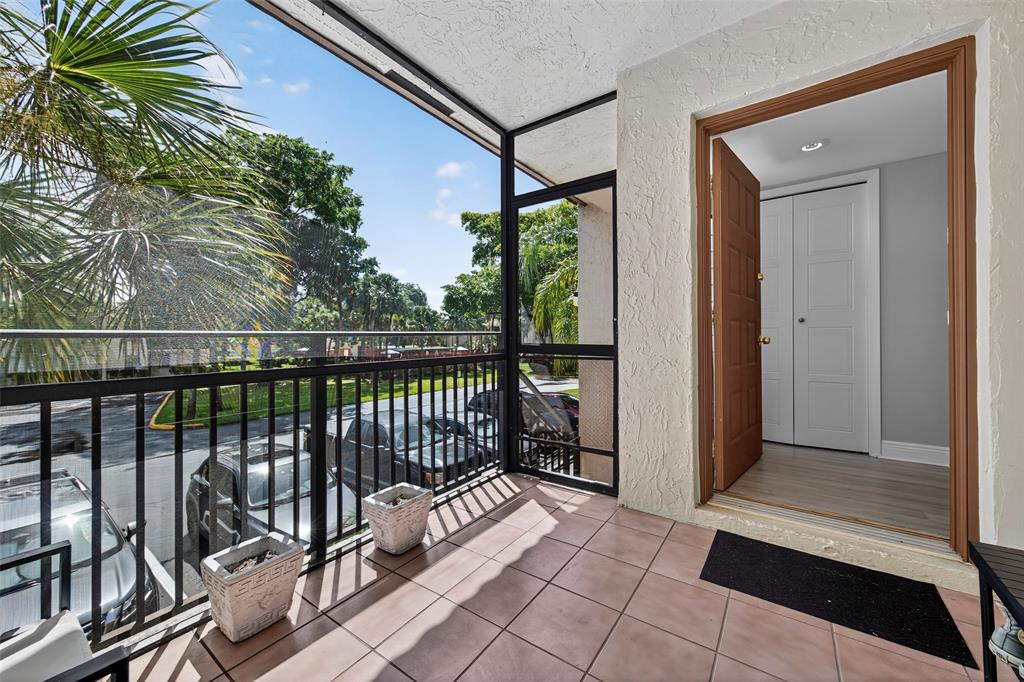 412 Lakeview Drive, Unit 202 Weston, FL 33326 - Photo 12 of 34 a view of a balcony with a potted plant