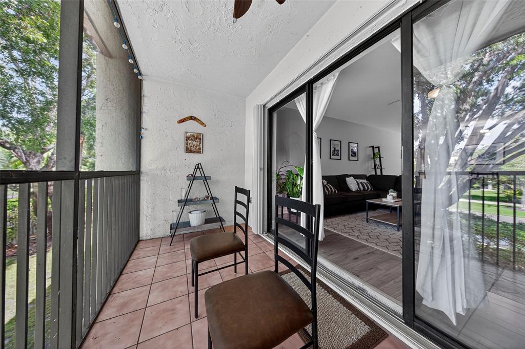 412 Lakeview Drive, Unit 202 Weston, FL 33326 - Photo 13 of 34 a living room with furniture