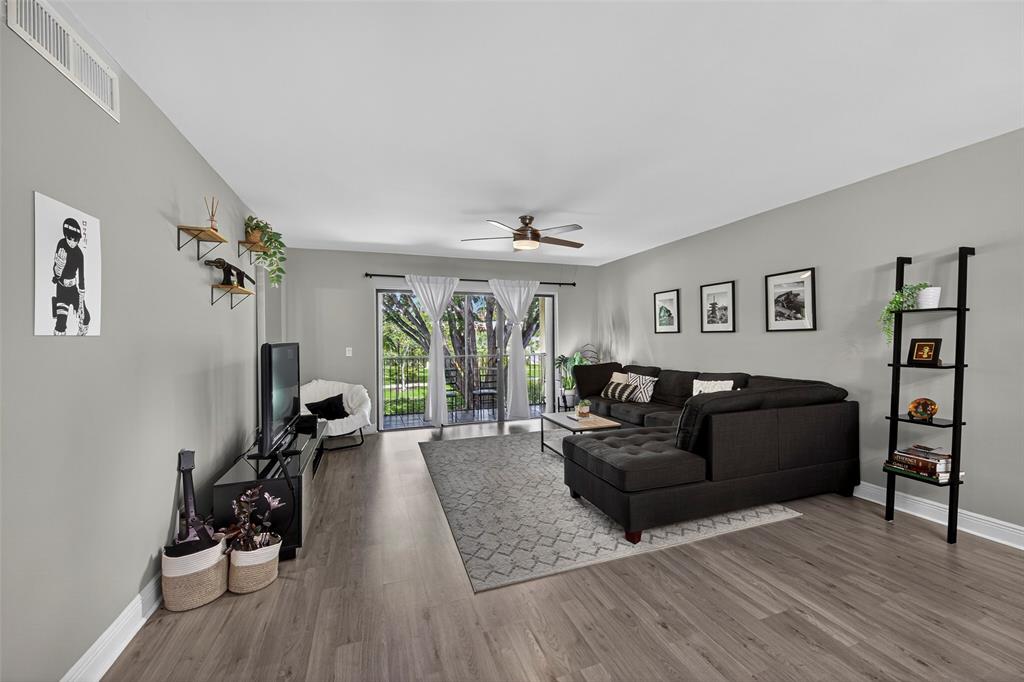412 Lakeview Drive, Unit 202 Weston, FL 33326 - Photo 14 of 34 a living room with furniture and a wooden floor
