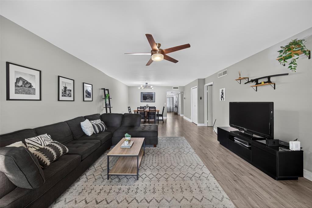 412 Lakeview Drive, Unit 202 Weston, FL 33326 - Photo 15 of 34 a living room with furniture and a flat screen tv