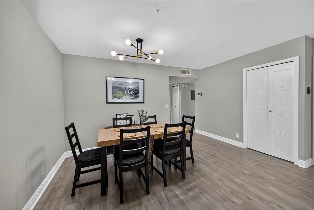 412 Lakeview Drive, Unit 202 Weston, FL 33326 - Photo 18 of 34 a view of a dining room with furniture and wooden floor