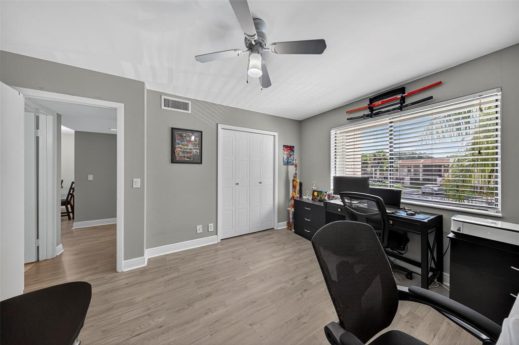 412 Lakeview Drive, Unit 202 Weston, FL 33326 - Photo 28 of 34 a view of a workspace with furniture and a window