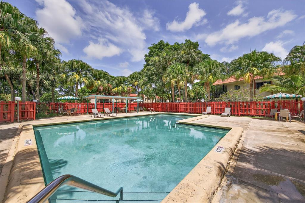 412 Lakeview Drive, Unit 202 Weston, FL 33326 - Photo 31 of 34 a view of swimming pool with outdoor seating